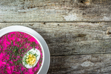 Cold soup with beet leaves served with cream, summer cooking con