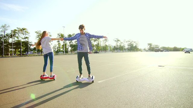 Young couple having fun with scooter