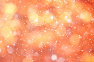 orange bokeh blurred background snowflakes glare