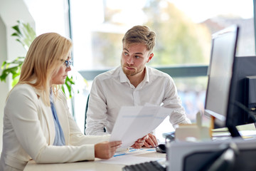 business team discussing papers at office table