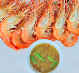  Boiled shrimps with seafood sauce on a white plate