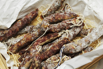 Beef jerky. Dried meat beef jerky on chopping board background. Dry meat, rustic country style....