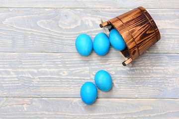 traditional eggs painted in blue color in bucket