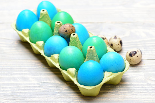 traditional eggs painted in bright color inside carton box