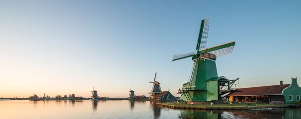 Rolgordijnen Traditional Dutch windmills with canal close © Nattawit