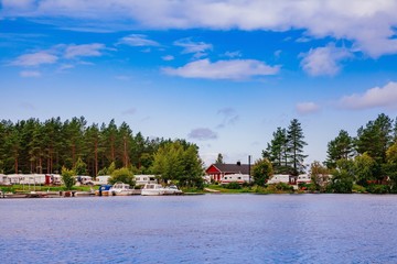 Fototapeta na wymiar Trailer park at the lake in Finland