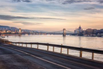 Fototapeta premium Pacified Budapest skyline before sunrise, view of historic buildings and Szechenyi Chain bridge across the Danube river, Hungary, Europe