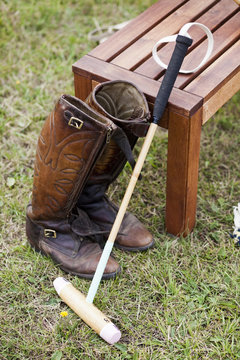 Polo mallet and leather riding boots