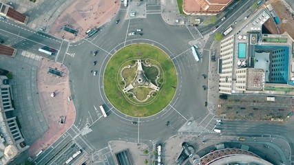 Aerial shot of Plaza de España in Barcelona, Spain. Roundabout city traffic