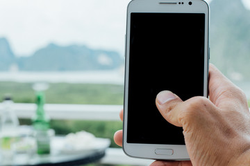 hand with phone blur view dinner place