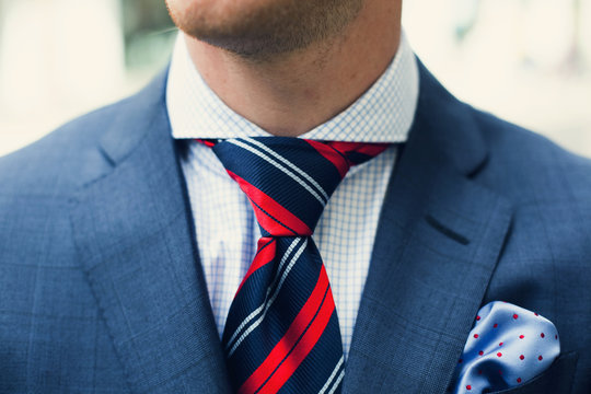 Close up of elegant man wearing full suit
