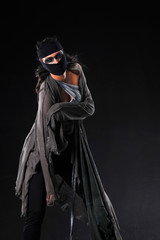     Warrior woman in different design clothes on black background 