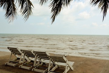 wooden chairs for relaxing in seaside in holidays