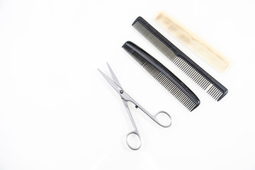 Hair cutting shears and comb isolated on white