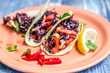 Salad of tomatoes, cabbage and herbs in a dough, lemon and red pepper