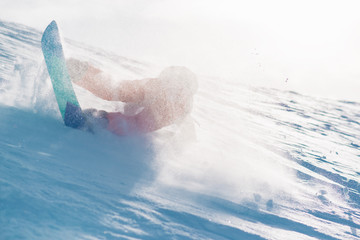 snowboarder is riding from snow hill and fall down © Аrtranq