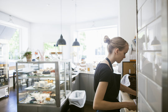 Young woman working in cafe