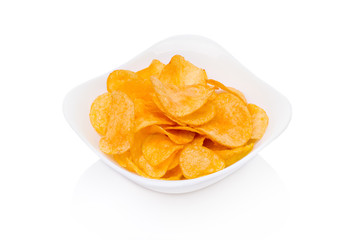 Potato chips bowl isolated on white. Close-up