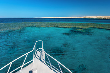 View at the coral sea from white yacht. Perfect place for snorkeling. Summer vacation in Egypt. Red sea with clear turquoise water.