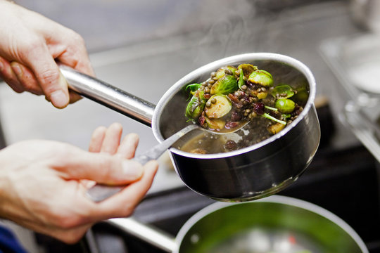 High angle view of chef preparing food at restaurant