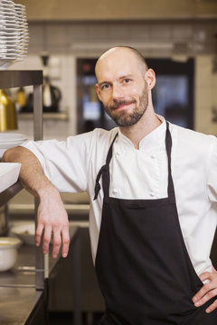 Portrait of confident chef at commercial kitchen