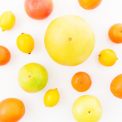 Lemon, orange, mandarin, grapefruit, sweetie and pomelo fruit on white background. Flat lay, top view. Summer fruits
