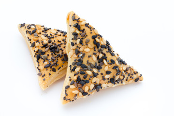 Crisps with nuts and seeds stacked on a white background.