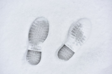 Men's footprints on fresh white snow