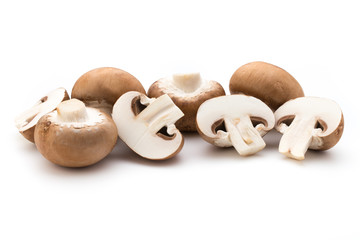 Fresh champignon mushrooms isolated on white.