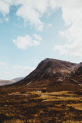 Fototapeta na wymiar Glencoe mountains on sunny day with blue sky in Scotland. Scottish Highlands.
