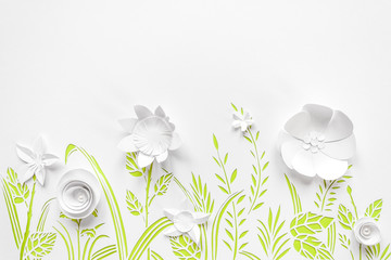 Summer flowering meadow. White flowers carved from paper on a white background with green leaves