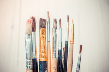 Obraz premium artistic brushes on wooden background 