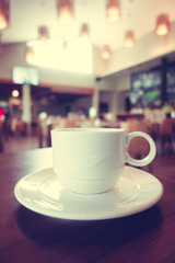 White coffee cup in coffee shop cafe