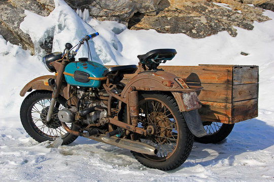 Old Ural motorcycle with a cradle