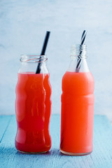 summer drink with fruit punch juice in bottle