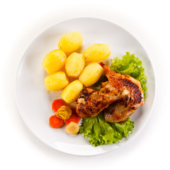 Roast chicken leg with potatoes