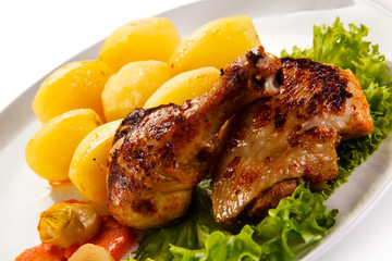 Roast chicken leg with potatoes