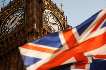 union jack flag and iconic Big Ben at the palace of Westminster, London - the UK prepares for new...