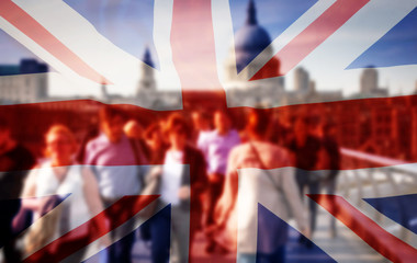union jack flag and people walking on Millenium bridge in the background, London - UK prepares for...