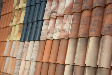 Samples of roof tiles on the roof in the exhibition hall. Industry