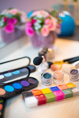 Obraz na płótnie Canvas Different makeup items on the table