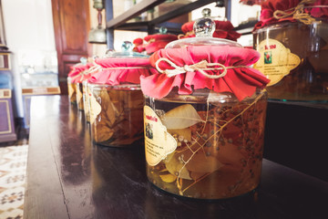 Ancient Thai herb jar with red cover