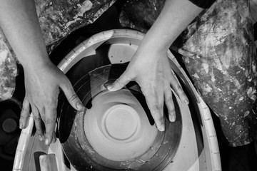 Potter works with clay top view