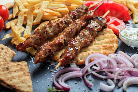 Grilled meat skewers on a pita bread