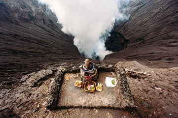 Poster Crater of Bromo volcano and Ganesha altar with offerings in Bromo Tengger Semeru National Park, East Java, Indonesia. Erupting and active volcano © linortis