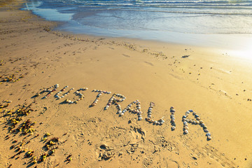 Australia word drawn on sand