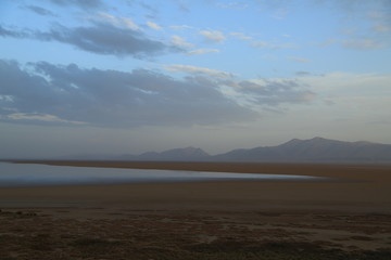 lake surrounded by desert   