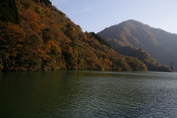 River and autumn leaves and mountains