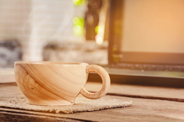 coffee cup and notebook on wood table