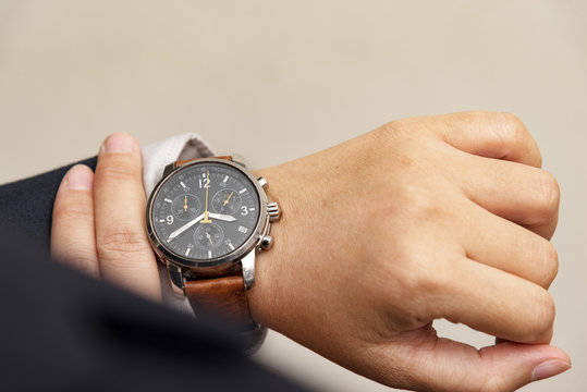 Businessman checking the time
